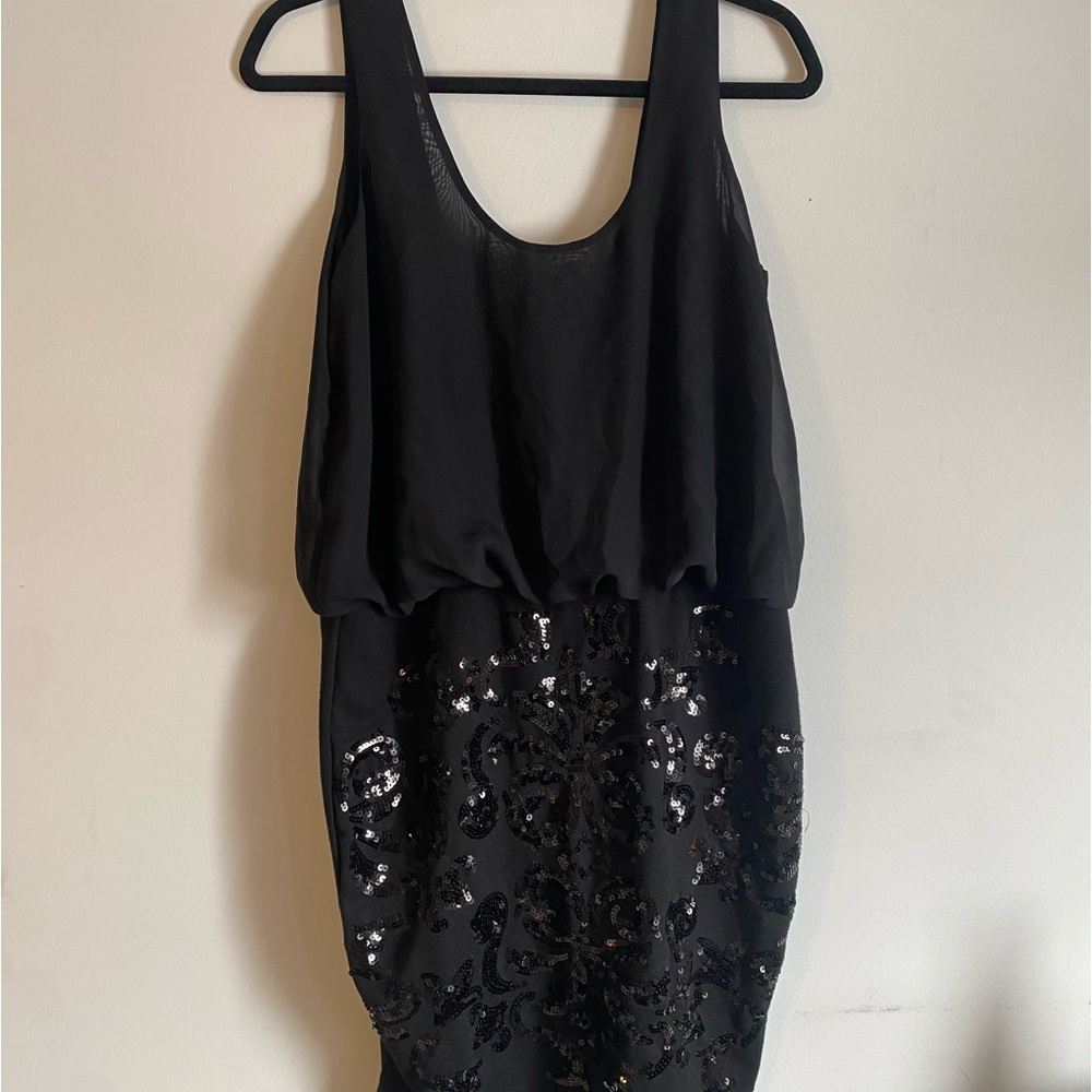 Sequenced black dress with sexy open back!